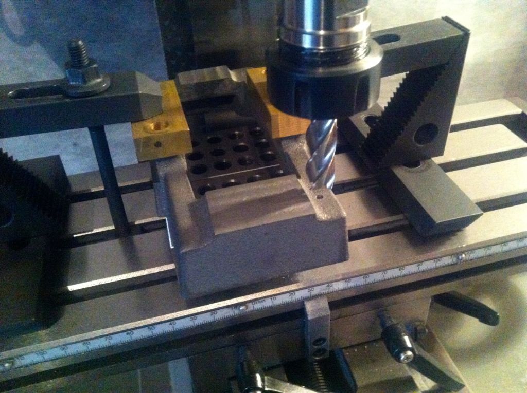 28. using 1:2 inch end mill to spot face the sole plate fixing holes.jpg