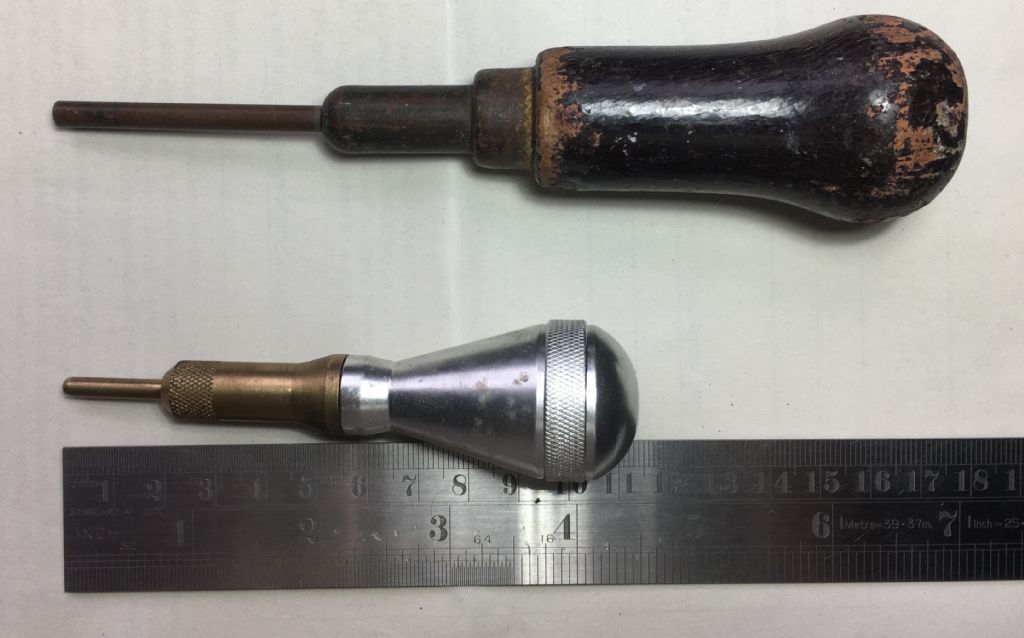 Push-pin and unidentified tool